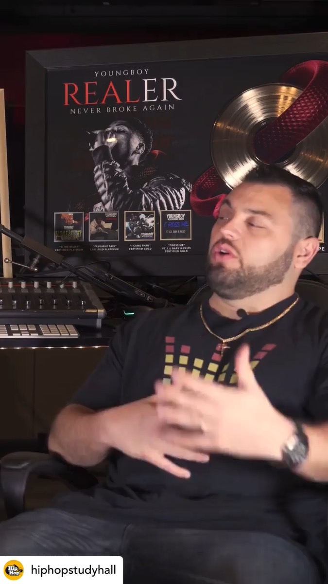 James Wood interview with YoungBoy plaque behind him